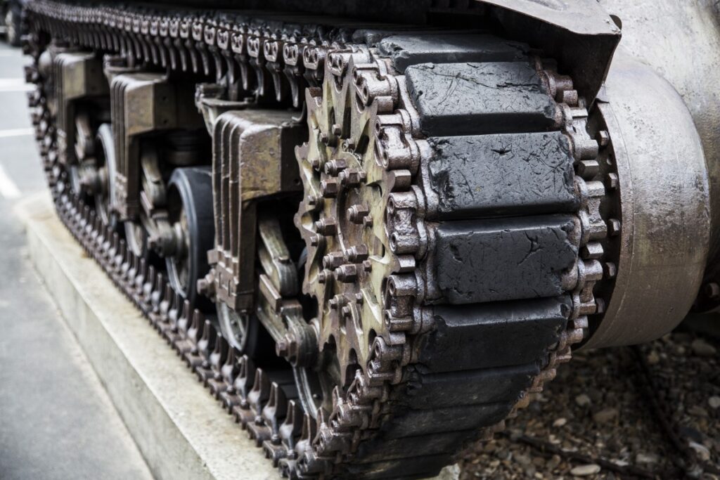 track, military, army, vehicle, metal, machine, weapon, tire, motor vehicle, war, engine, attack, tank, heavy, armour, conflict, defense, combat, artillery, armor, armored, auto part, automotive exterior, automotive tire, combat vehicle