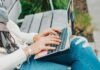 Chatiw and CamMatch – Live Free Chat Room person in white long sleeve shirt and blue denim jeans using macbook pro
