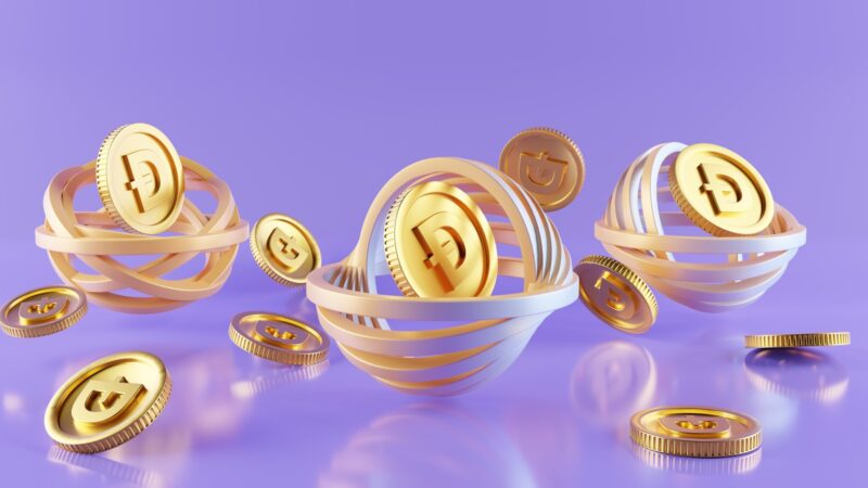 Photo by GuerrillaBuzz a group of gold coins