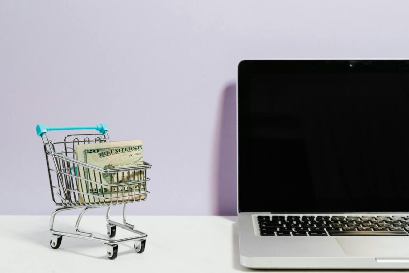 Photo by Karolina Kaboompics Shopping Cart Next to a Laptop