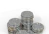 The Problem Theta Seeks to Resolve in Technology a pile of silver bitcoins sitting on top of each other