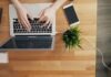 What is ITSM Process? a person typing on a laptop on a wooden table