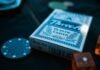 PokerStars: как скачать рум бесплатно? TreeA plastic coated card deck beside poker chip and dice