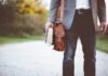 Top 5 Benefits Of Joining Safe Certification man holding book on road during daytime