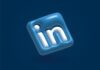 Mastering LinkedIn Poll Ads: A Comprehensive Guide to Boost Engagement and Generate Leads a blue and white linked icon on a blue background