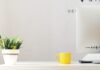 How to Create a Cozy and Functional Home Workspace yellow ceramic mug beside gray aluminum iMac