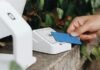 Defining a Credit Tranche Within Asset-Backed Securities A person holding a credit card next to a machine