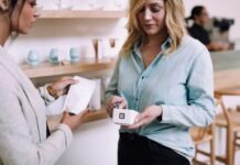 How to Set Up an Android Card Swipe Machine for Your Store? woman holding white pack