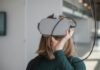 How Augmented Reality (AR) is Transforming Today’s Online Casino Games woman in black sweater holding white and black vr goggles