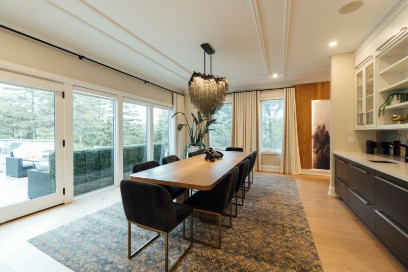 Photo by Ariel Domenden a dining room with a table and chairs
