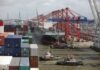Securing Supply Chains: The Promise of Blockchain in Oil Trade a tug boat in the water next to a large cargo ship
