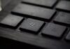 How to Fix the “Command Not Found: Conda” Error black laptop computer keyboard in closeup photo