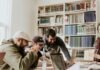 Top Benefits of a Student Savings Account: Why Every Student Should Have One three men laughing while looking in the laptop inside room