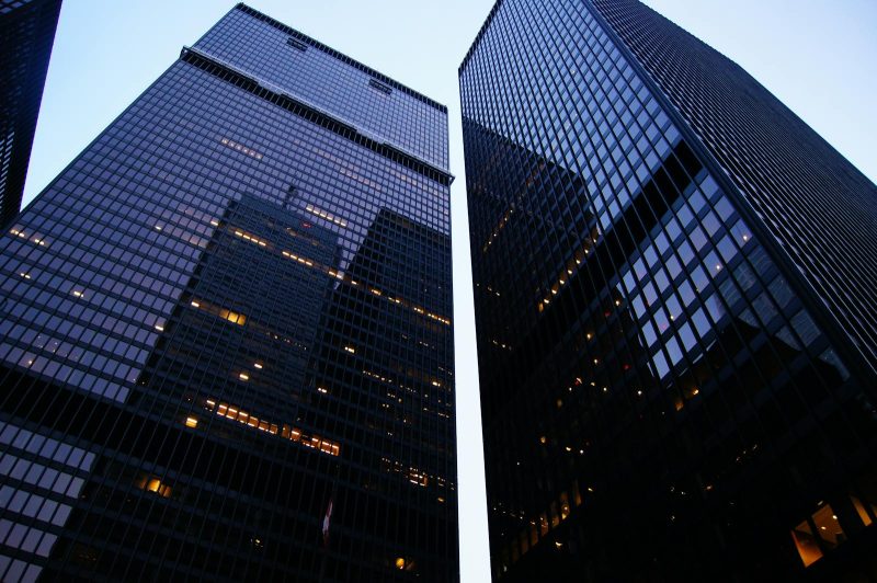 Photo by Paul Loh Dramatic low angle view of Toronto's skyscrapers reflecting the evening sky.