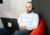 How Do Virtual Assistants Fit Into the Healthcare Industry? Call center agent working remotely on a laptop with headset and microphone for customer service.