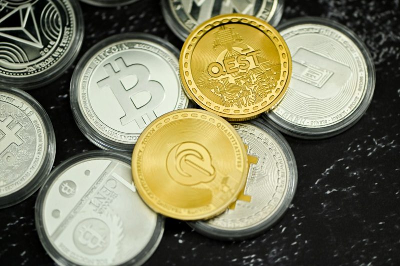 Photo by Traxer a pile of coins sitting on top of a table