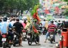 Best EV Scooter in India: Our Picks for 2024 a group of people riding motorcycles down a street