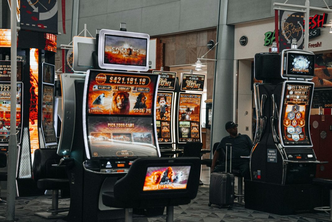 Photo by Nejc Soklič a row of slot machines sitting next to each other