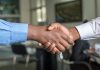 What Should You Consider Before Selling Your Business? two people shaking hands