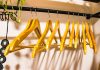 How to Declutter Before a Move a rack of clothes hanging on a wall