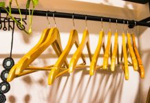 How to Declutter Before a Move a rack of clothes hanging on a wall