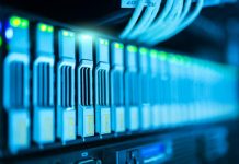 5 Reasons Why Internet Speeds Fluctuate Detailed image of a server rack with glowing lights in a modern data center.