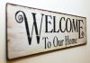 7 Simple Steps to a More Peaceful Home A stylish rustic wooden welcome sign perfect for home decoration.