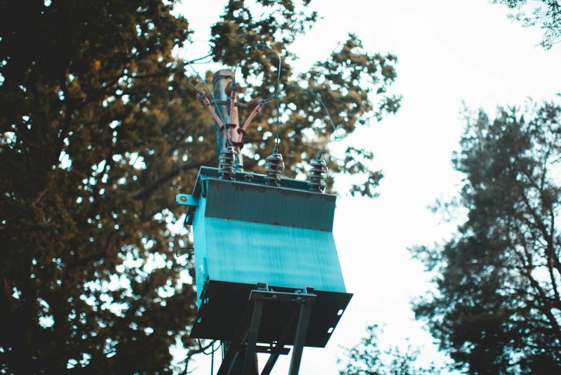 Photo by Dom Heartley blue and white concrete building near green trees during daytime