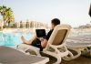 The Impact of Influencers and Celebrities in the Online Space man on sun lounger using laptop