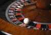 Are Gambling Bonuses Really Worth It? Here’s What You Need to Know Detailed close-up image of roulette wheel highlighting numbers and spinning ball in a casino setting.