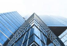 The Role Of Mergers And Acquisitions In Corporate Recapitalization low angle photography curtain wall buildings