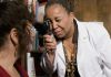 The Importance of Regular Eye Exams for Retina Health a woman holding a cell phone up to her face