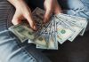 SIP for Wealth Building, SWP for Income Generation: How to Use Both Calculators Effectively fan of 100 U.S. dollar banknotes
