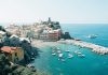 Seaside Villas in Italy: Living the Dream aerial view of city buildings near body of water during daytime