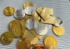 Top 7 Cryptocurrencies for the Modern Investor a pile of gold and silver coins sitting on top of a table