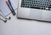A Detailed Overview of What to Expect in a CISSP Online Course silver laptop computer beside white ruled paper