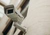 What to Expect from a Professional CCTV Installation Service Close-up of a security camera on a building wall, showcasing surveillance technology.