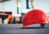 3 Things That Can Derail Your Workers’ Compensation Case red hard hat on pavement