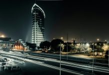 Why is Gurgaon known as the Millennium City of India? buildings and road lights during nighttime