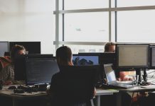 Hiring Your First Android App Developer: Best Practices And Actionable Tips people sitting on chair in front of computer monitor