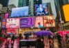 Smart Brands Aren’t Skipping Outdoor Exposure woman in black leather jacket holding pink umbrella
