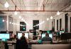 The Benefits of Implementing Knowledge Management Software in Your Organization A group of professionals collaborating to streamline organizational processes using knowledge management software and tools