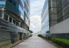 How Investors Are Adding Value to Communities With These 3 Commercial Real Estate Investments a long brick walkway between two tall buildings
