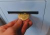 Need Cash or Crypto Now? Here’s Where to Find a Bitcoin ATM That’s Open a person is holding a bitcoin in their hand