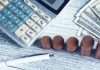 Understanding Risk and Return: How Lumpsum Calculators Help Prepare for Volatility a calculator, pen, and money on a table