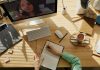Avoid Legal Trouble: Why Compliance Training is Better Online A student taking notes during a video call for online learning at home.