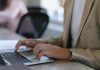 The Essentials of SSE: Understanding the Fundamentals Unrecognizable male worker in formal wear browsing modern netbook while sitting at table during work in office with colleague on blurred background