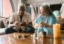 Senior Living Communities vs. Nursing Homes: What’s the Difference? Senior couple enjoying a calm afternoon indoors with relaxing activities.