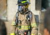 The Role of Radio Straps in Firefighter Communication man in green and brown camouflage jacket wearing gas mask