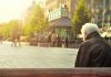 How to Prepare for the Unexpected in Retirement A senior man sitting on a bench in Jyväskylä, Finland. Captured during a sunny day in the city square.